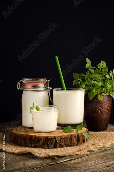 Fototapeta Dairy starter culture for the preparation of fermented milk products, yogurt, kefir with a copy space on a wooden cut
