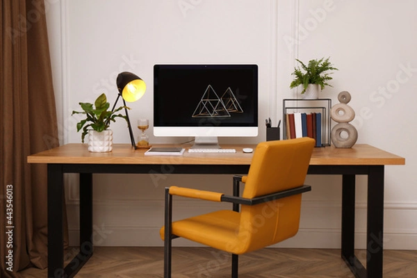 Fototapeta Room interior with comfortable workplace. Modern computer on wooden desk