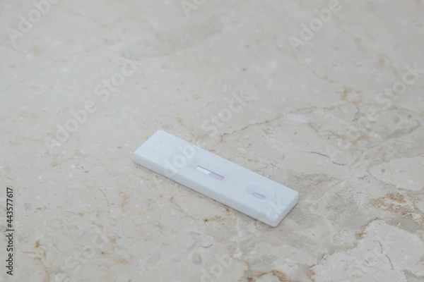 Fototapeta Negative SARS COV rapid antigen test on light background. Coronavirus crisis. Global pandemic.