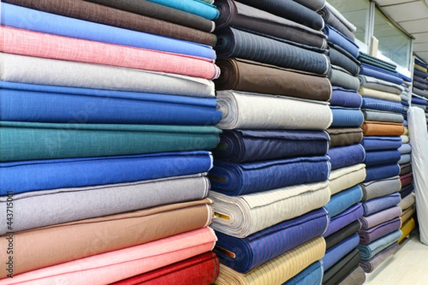 Obraz dowry and dress fabrics in accordance with Turkish traditions. bridal fabrics. Colorful fabrics were lined up on the shelves of the fabric store. selective focus