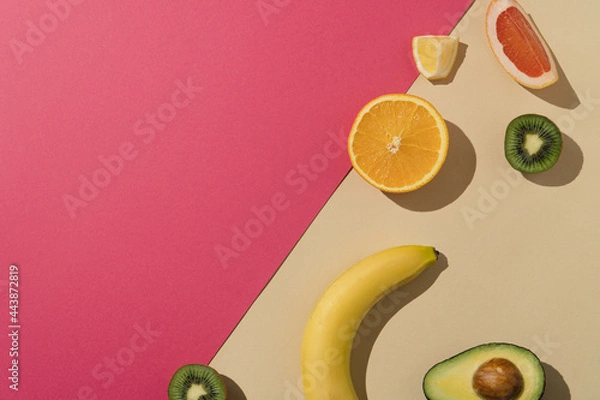 Obraz Fresh summer fruit arrangement. Pink and beige background with copy space.
