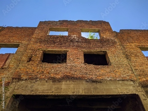 Fototapeta ruined and old building outside view in the daytime.