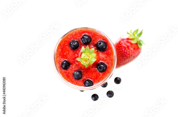 Fototapeta Fresh berries fruit and smoothies in tall glass on white . Blueberries and strawberries. Top View
