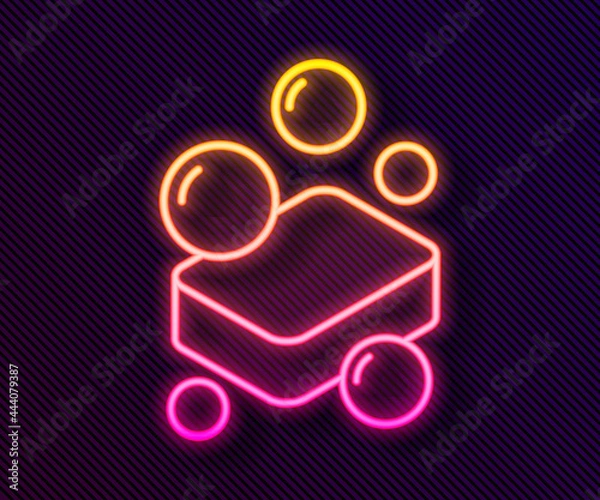 Fototapeta Glowing neon line Bar of soap icon isolated on black background. Soap bar with bubbles. Vector