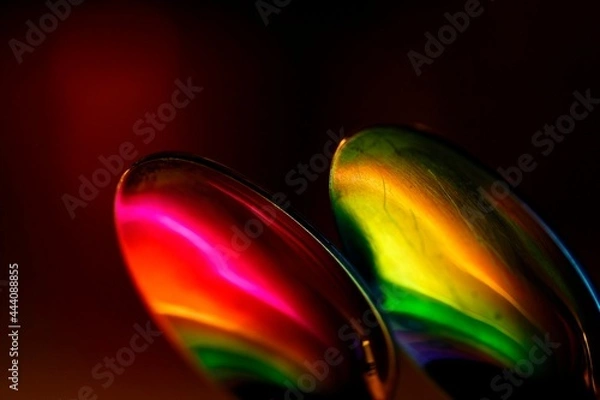 Obraz Two tablespoons reflecting bright colors. Abstract stylization.