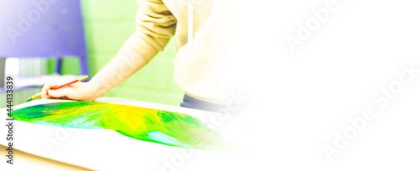 Obraz a person draws with a brush and paints on a large canvas in an art studio. creative, modern artist of fine art, a masterpiece of drawing, drawing training, art school, distance drawing courses, banner