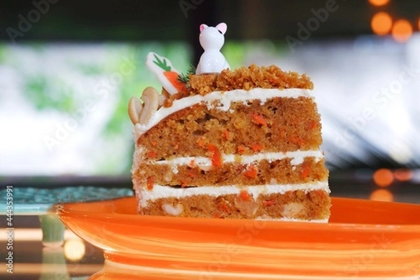 Obraz A slice of carrot cake on a dish.