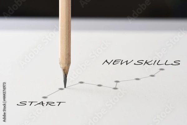 Obraz Start to new skills with growth graph written on white paper with pencil. Education planning improvement concept and sustainable business success idea