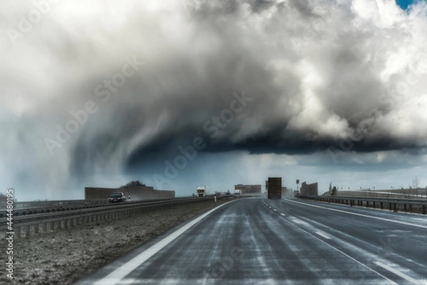 Obraz Dramatic view of a shelf cloud over a highway, horizontal cloud formation, panorama view.