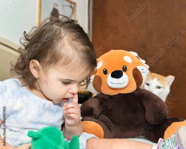 Obraz little child playing with a toy