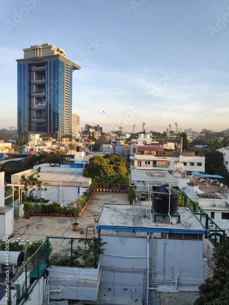 Obraz A sunlit view of rooftops and buildings in downtown Bangalore, India on a clear sunny day