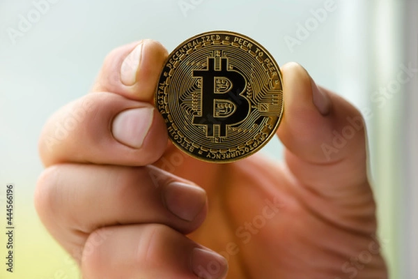 Obraz bitcoin in hand closeup.