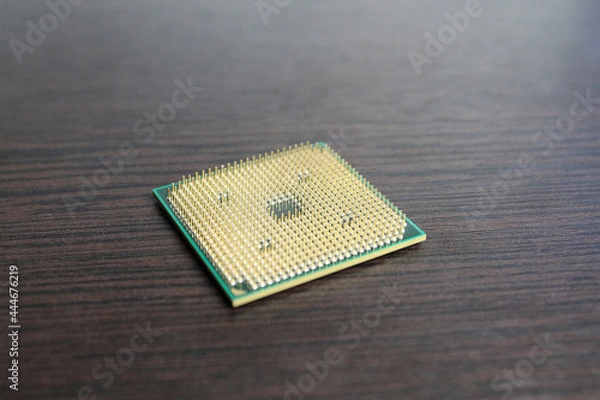 Obraz Processor contacts up against a dark wood background