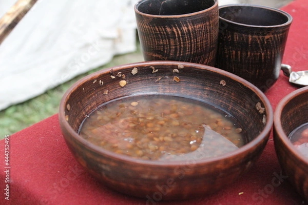 Fototapeta lentils and beans soaked in water in a wooden dish for cooking