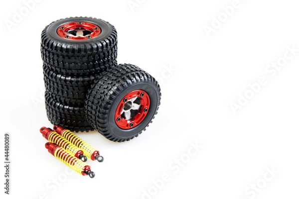 Obraz shock-absorbers and wheels of rc car on a white background