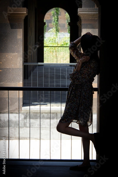 Obraz beautiful girl looking out balcony back view