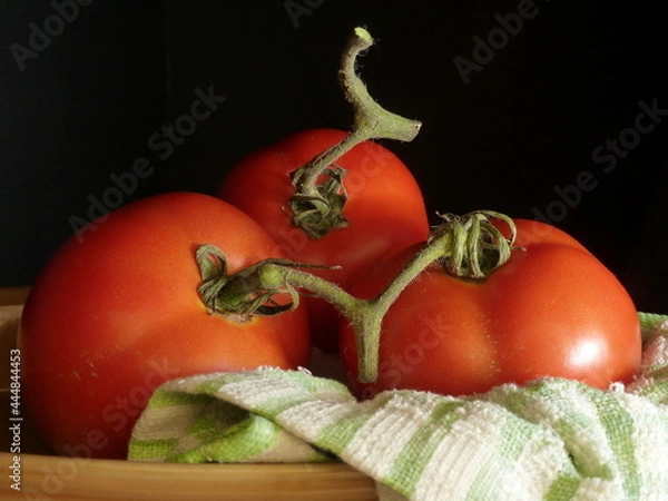 Obraz tomatoes on a black background