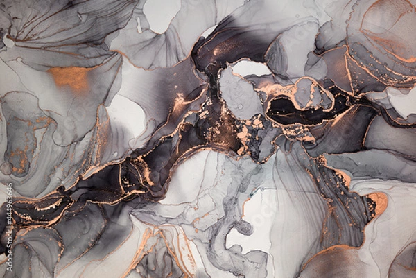 Fototapeta Luxury abstract fluid art painting in alcohol ink technique, mixture of black, gray and gold paints. Imitation of marble stone cut, glowing golden veins. Tender and dreamy design.