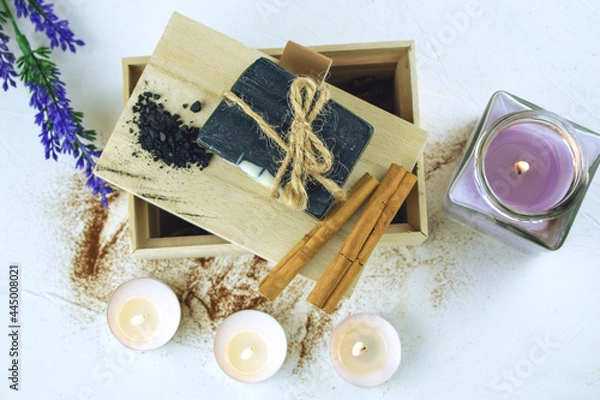 Obraz Block of natural carbon soap on a wooden board