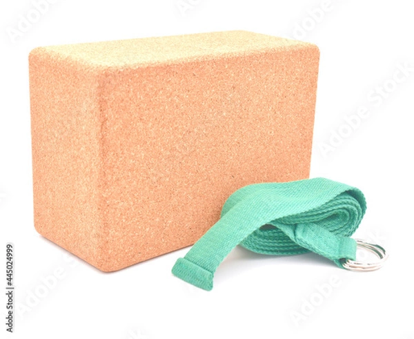 Fototapeta Cork yoga block and green strap isolated on a white background
