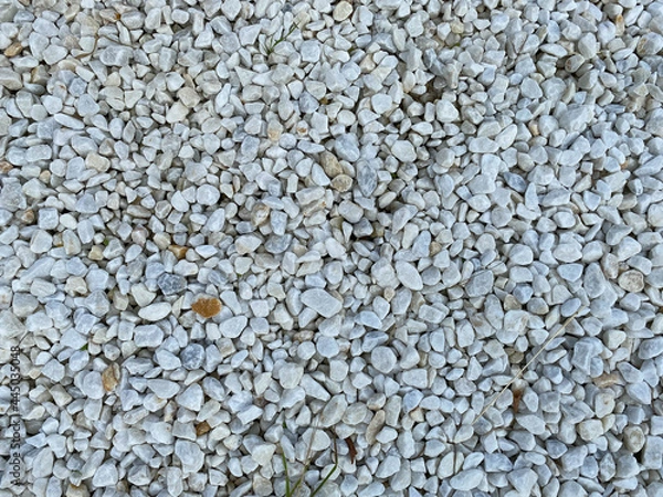 Fototapeta White texture from small sharp natural decorative stones. The background