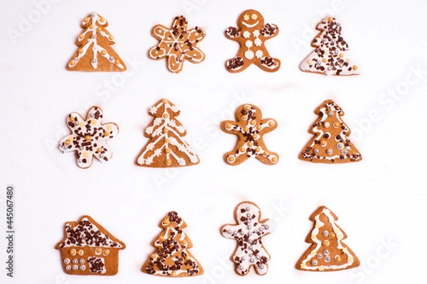 Fototapeta Gingerbread cookies lying on a white background 