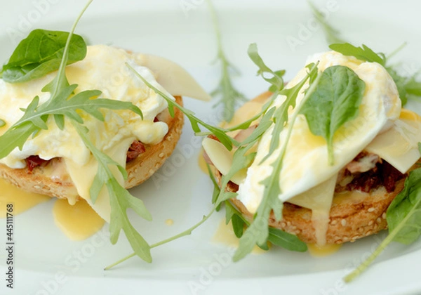 Fototapeta Eggs Benedict and green leafs