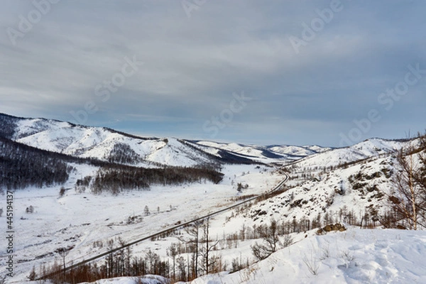 Obraz The road between the snow-capped mountains