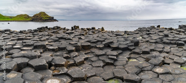 Obraz Giant's Causeway basalt rocks pattern in a beautiful summer day, Northern Ireland. The nature hexagon stones result of an ancient volcanic fissure eruption.