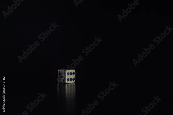 Obraz dice number six on black background.