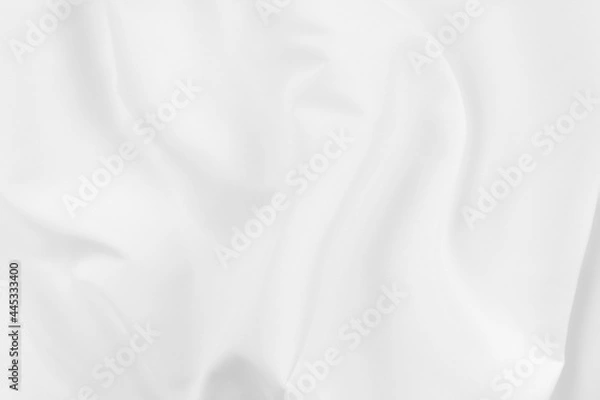 Fototapeta Abstract white fabric texture background. Cloth soft wave. Creases of satin, silk, and cotton.