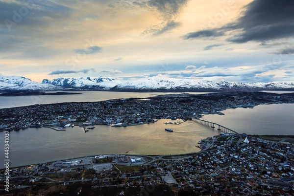 Fototapeta Scenic panoramic view over Tromso in northern Norway on a stormy cloudy evening, late spring with mightnight sun