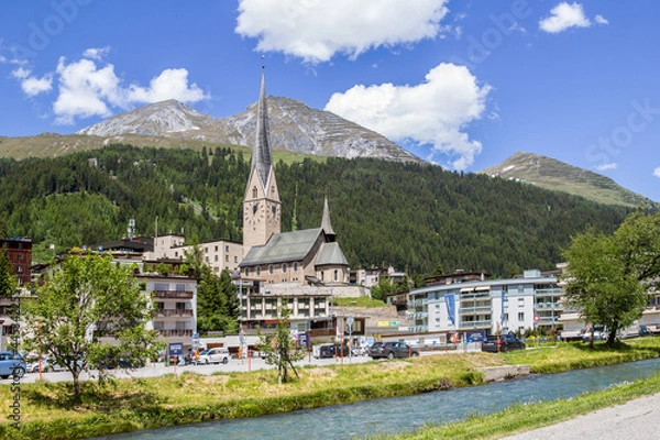 Obraz Davos Platz, Switzerland - June 24. 2021: The Reformed Church of St. John in Davos in the canton of Grisons. It is the oldest valley church in the Davos countryside, Switzerland