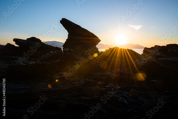 Obraz Distinctive rock formation at a fjord landscape in northern Norway on a warm summer evening with midnight sun