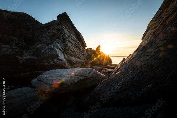 Obraz Canyon like rock formation at a fjord landscape in northern Norway on a warm summer evening with midnight sun