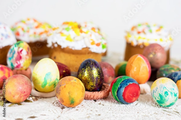Fototapeta Easter cakes with Easter eggs on a vintage tablecloth, preparation for the holiday