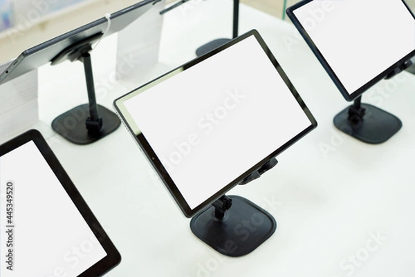 Fototapeta Blank monitor screens on a showcase in a shopping centre with copy space.