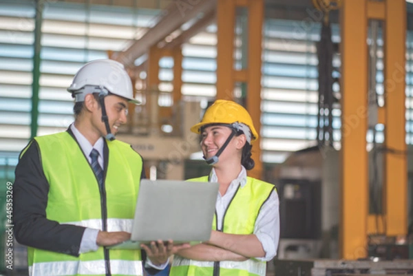 Fototapeta Asian Engineer working in factory .Teamwork ,Unity Concept.