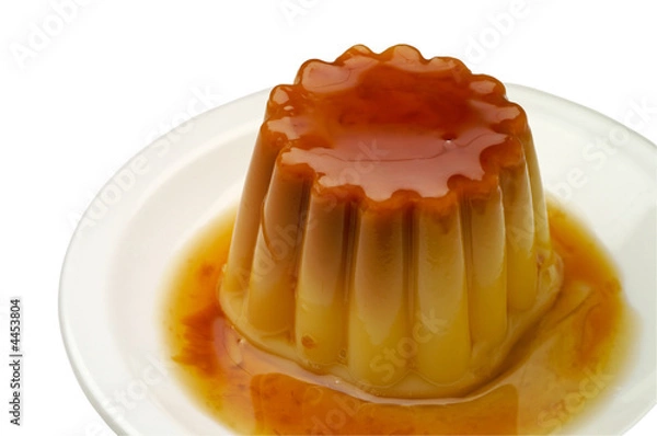 Fototapeta Creme caramel in a dish closeup with clipping path