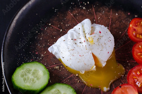 Obraz Poached egg or benedict on black plate