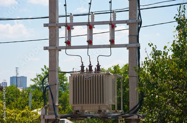 Fototapeta High voltage transformer on poles, fuses and wires.