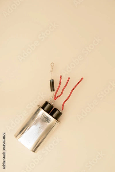 Fototapeta Top-down shot of electronics components isolated against a whitish background. 
