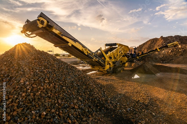 Fototapeta Heavy and mobile machinery in a quarry to transform stone into construction material