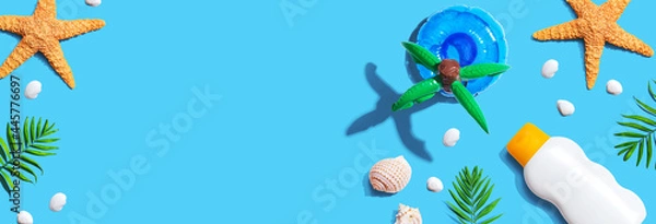 Fototapeta Sunblock bottle with starfish and seashells