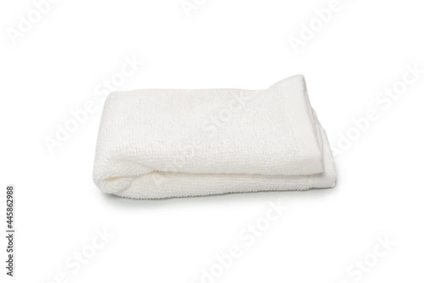 Fototapeta White fluffy cotton towel isolated on a white background.