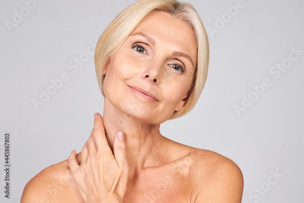 Obraz Cute mature lady is enjoying her perfect skin.