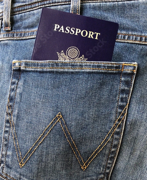 Obraz Blue US passport in the man's jeans or denim's rear or back pocket.
