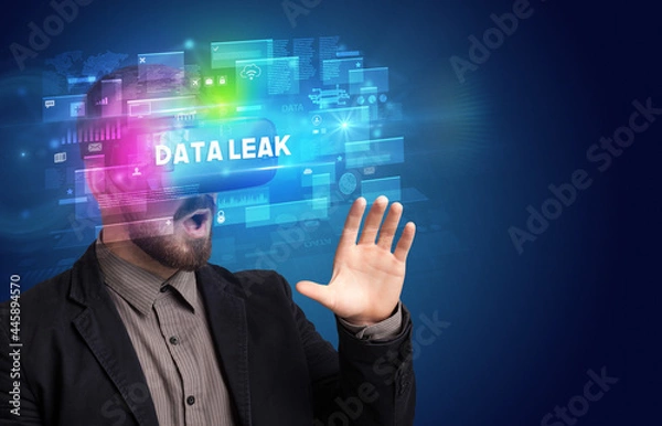 Fototapeta Businessman looking through Virtual Reality glasses