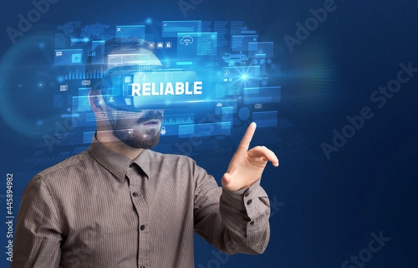 Fototapeta Businessman looking through Virtual Reality glasses