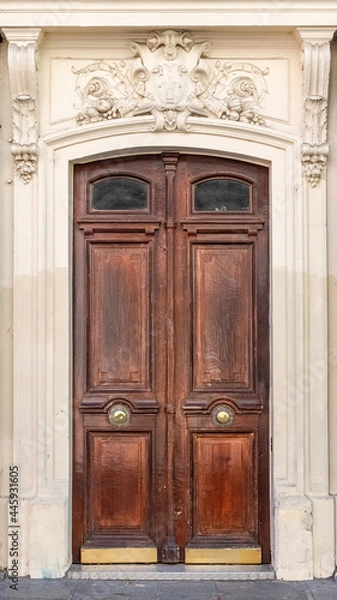 Fototapeta Paris, an ancient wooden door, typical building in the 10e arrondissement
